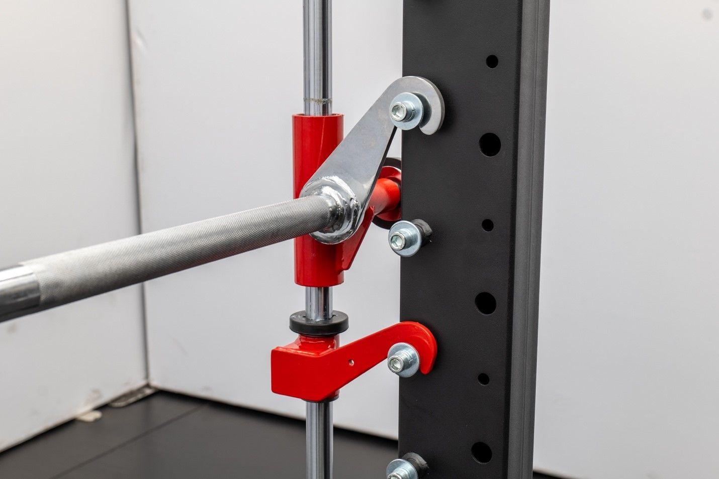 Smith machine with safety spotters